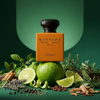 A bottle of RAVVINE INT. UNTAMED PARFUM perfume stands centered against a dark green gradient background, surrounded by citrus slices, herbs, cinnamon sticks, and peppercorns. Inspired by Dior Sauvage EDP
