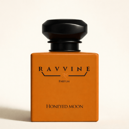HONEYED MOON perfume bottle by Ravvine with an orange design and elegant packaging.