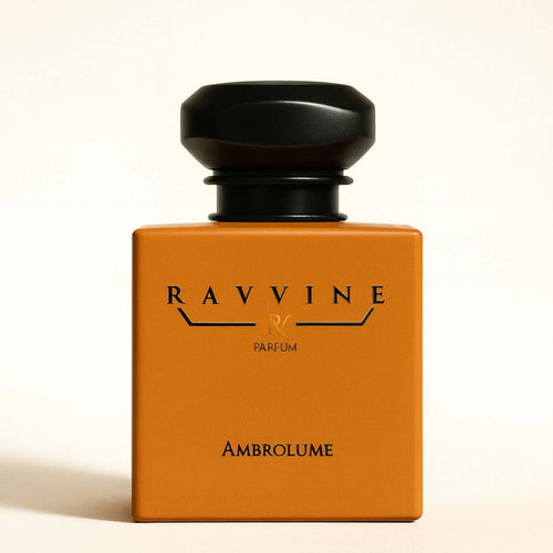 AMBROLUME fragrance bottle by Ravvine, showcasing a vibrant orange design with elegant detailing.